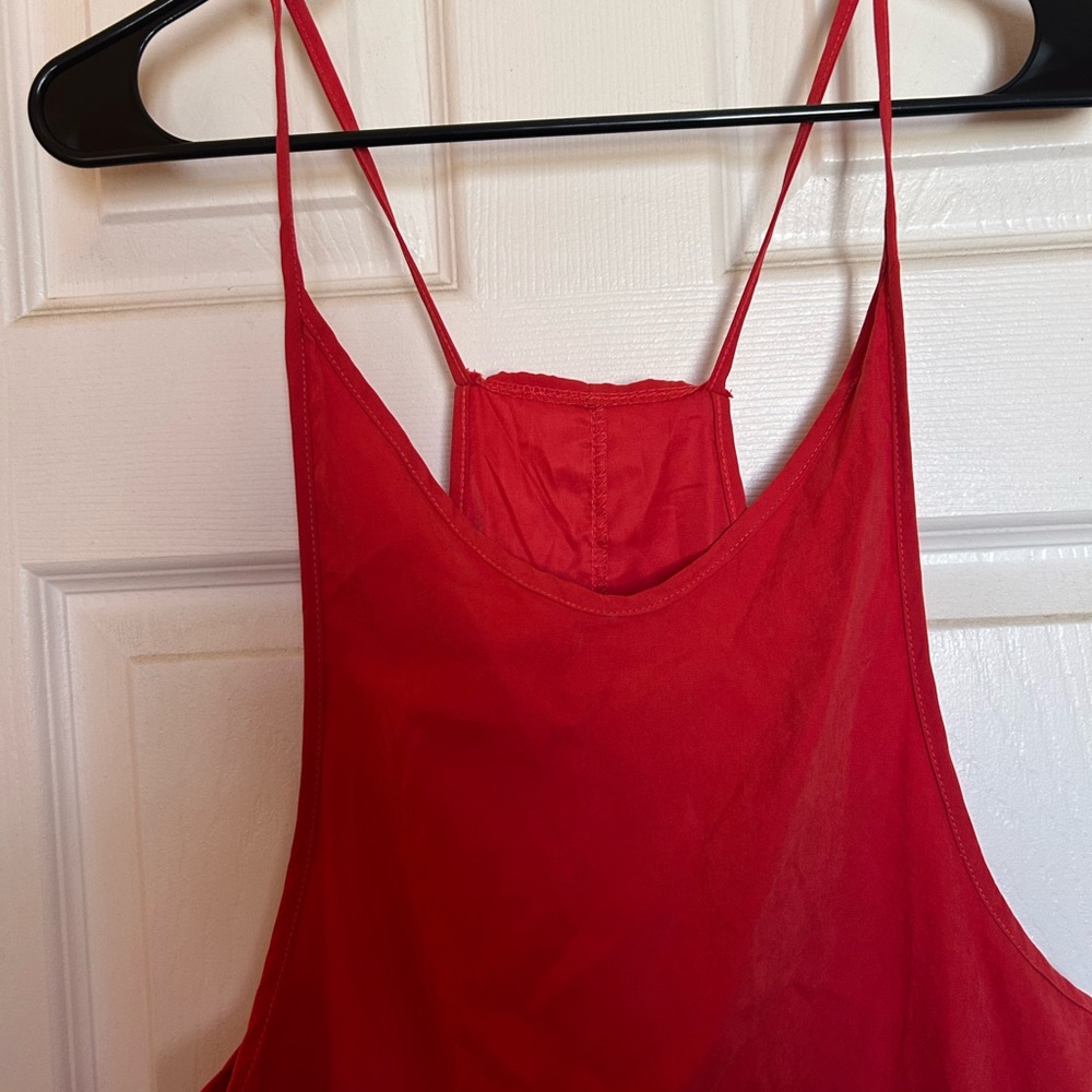 One piece red toned jumpsuit. Material soft and comfortable- not stretchy
